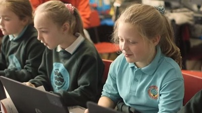 Young Students using minecraft on computers