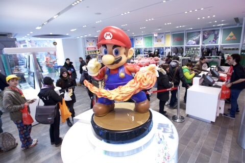 In this photo provided by Nintendo of America, guests explore the remodeled Nintendo NY store in Rockefeller Plaza at the reopening on Feb. 19, 2016.