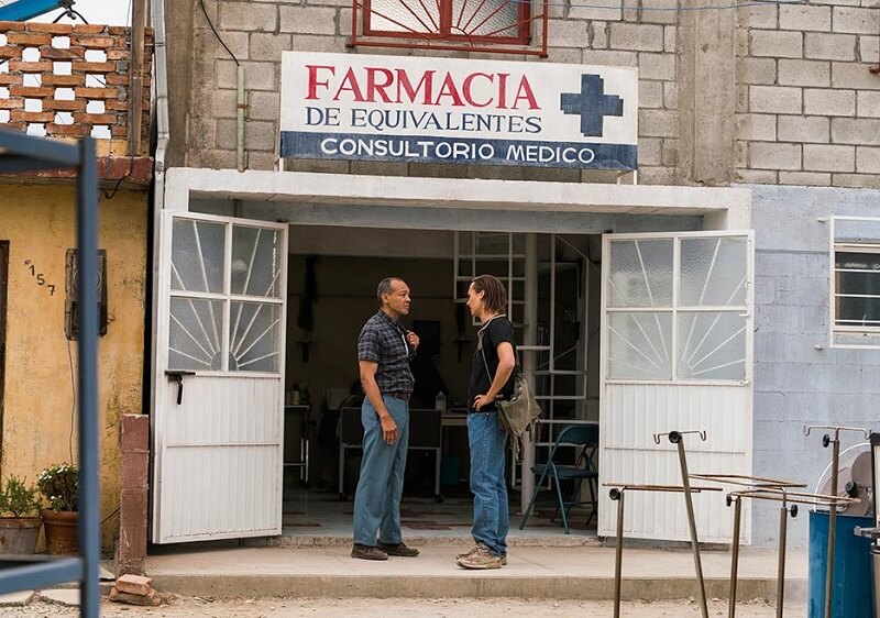 Nick and Alejandro outside the infirmary in Colonia talking