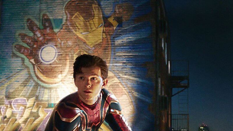 Peter Parker with Iron Man mural in Spider-Man: Far From Home