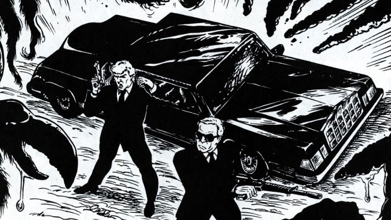 J and K fighting threats in the comics