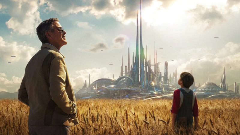 George Clooney stands in a field, looking at a futuristic city in Tomorrowland