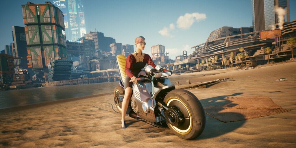 Top 6 Best Intelligence Perks in Cyberpunk 2077, Ranked V sits on her motorcycle on the beach in Cyberpunk 2077