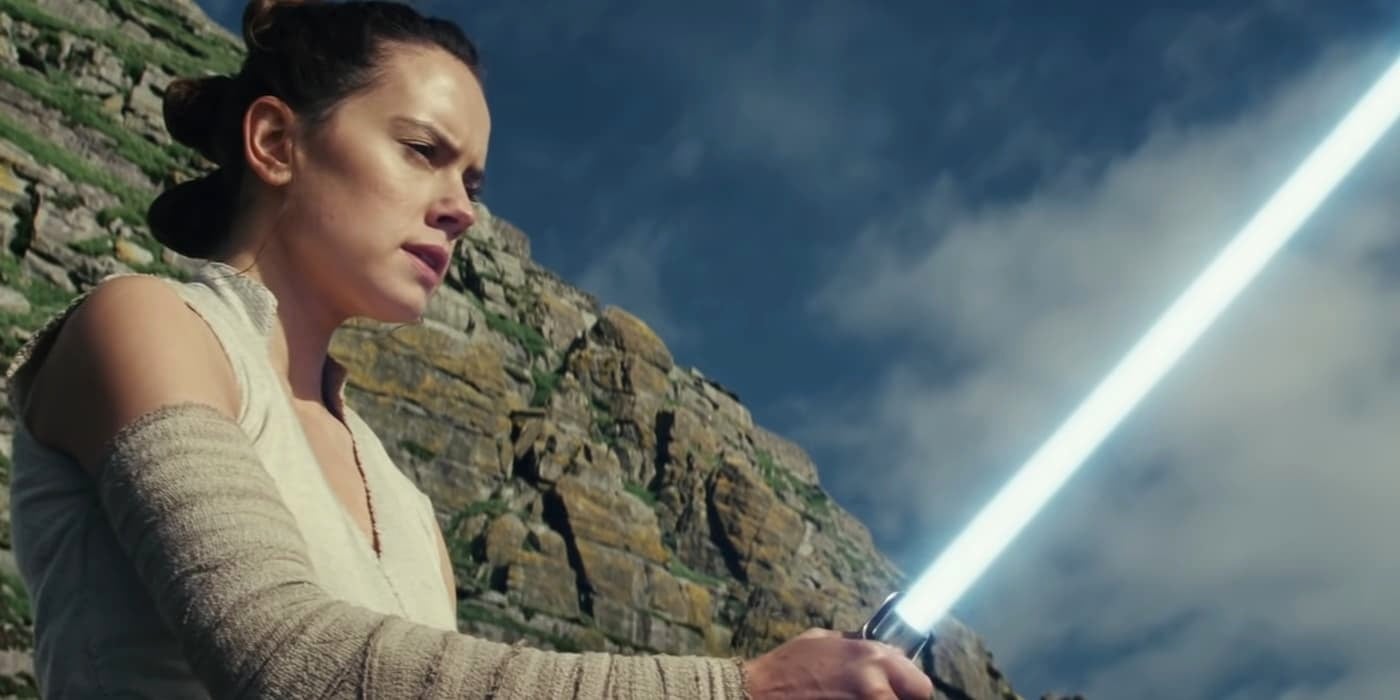 Rey with a lightsaber in Star Wars The Last Jedi