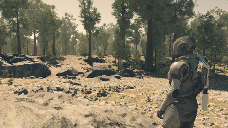 The Starborn walks through a forest in Bethesda's new sci-fi RPG, a landscape created using procedural generation