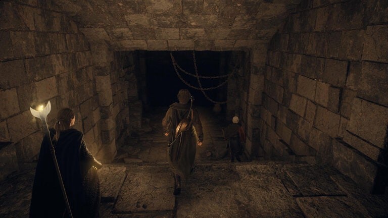 Where To Use the Ancient Battleground Key in Dragon’s Dogma 2 The Arisen and his party explore the halls of the Ancient Battleground Outpost.
