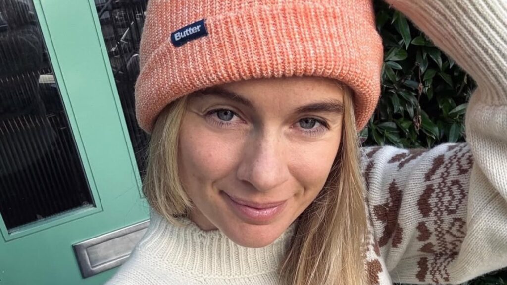 Prince Harry's ex-girlfriend Cressida Bonas in a peach beanie and sweater.