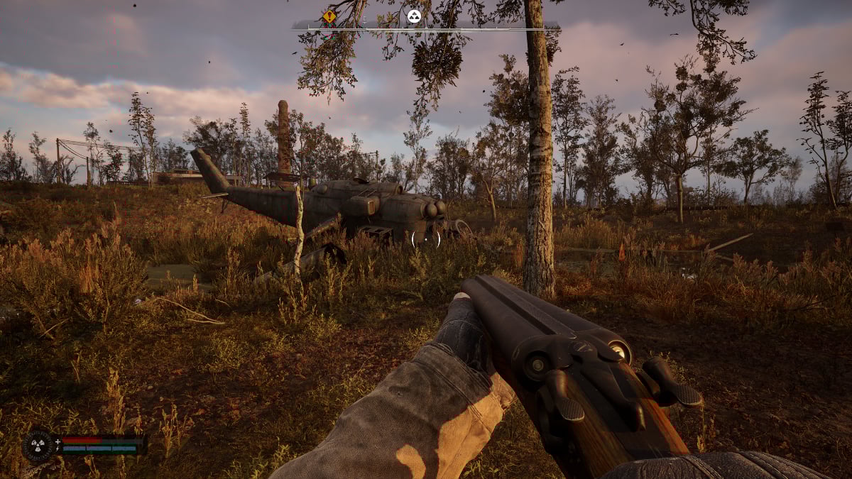The player approaches a downed helicopter with a shotgun in Stalker 2
