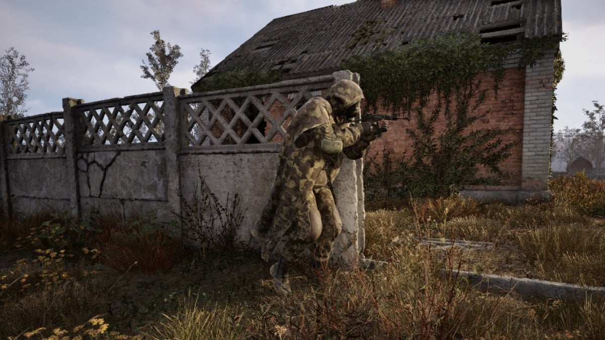 A stalker sweeps around a fence, gun drawn