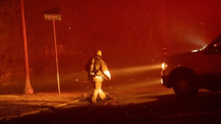 16 Days Later, California Is Still On Fire, & Some Fear News of the Lilac Fire Is Being Censored: ‘The Fires Disappeared from My FYP’ A Californian firefighter waalks down the street