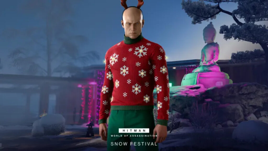 Agent 47 poses in a festive holiday sweater and reindeer ears in Hitman: World of Assassination
