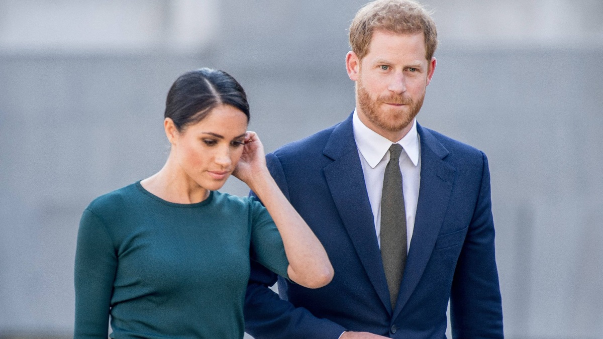 Meghan Markle in a green outfit, beside her husband Prince Harry in Montecito.