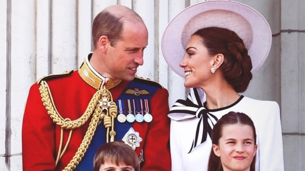 Prince William and his wife Kate Middleton standing on the Palace balcony with their kids.