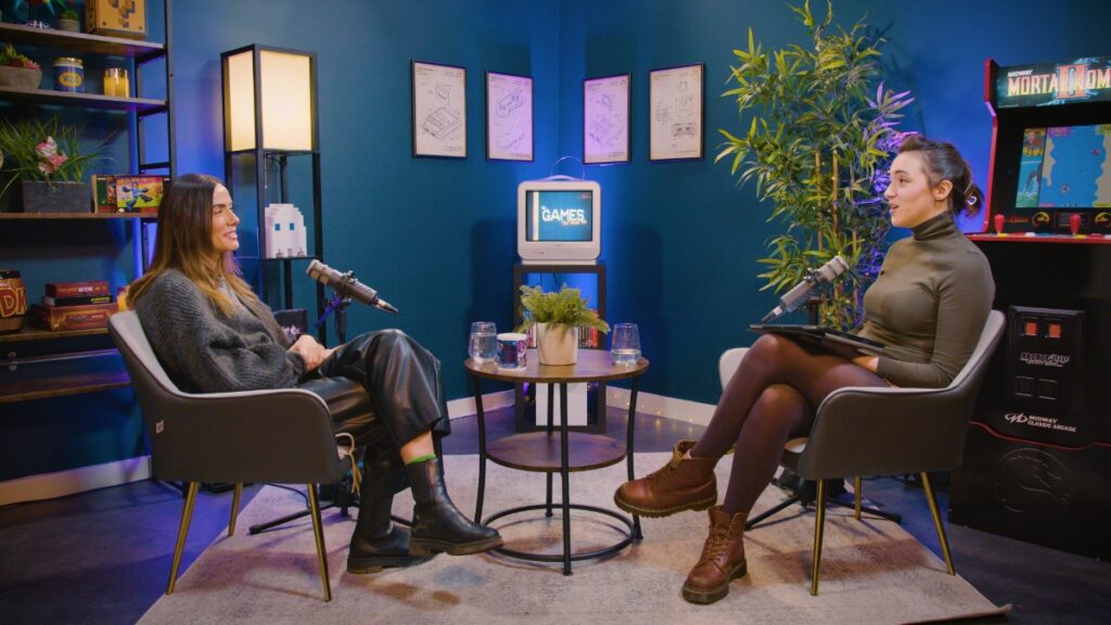 A two-shot of Devora Wilde speaking with an interviewer