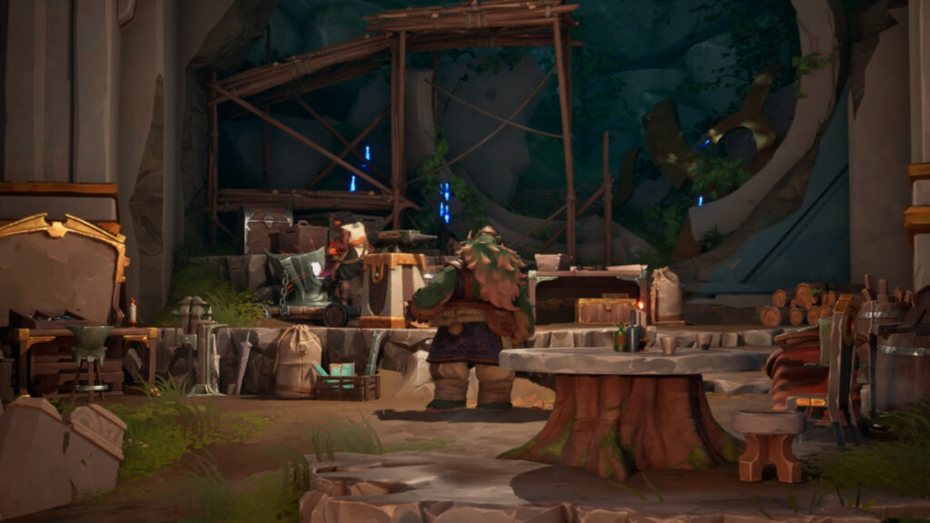 Sevastyan stands with his back to the viewer, making preparations near the forge