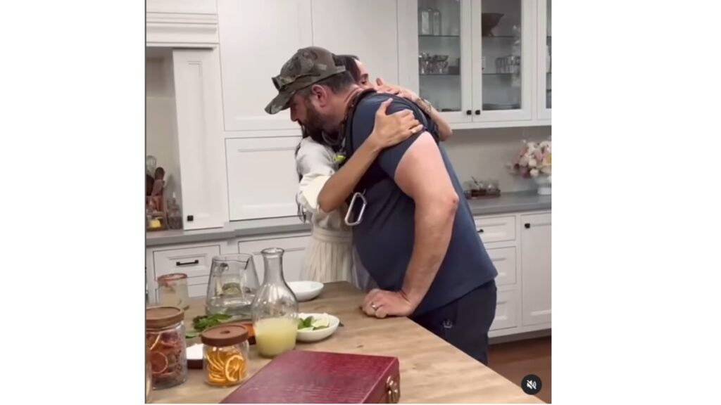 Meghan Markle embraces a staff member on her cooking show.