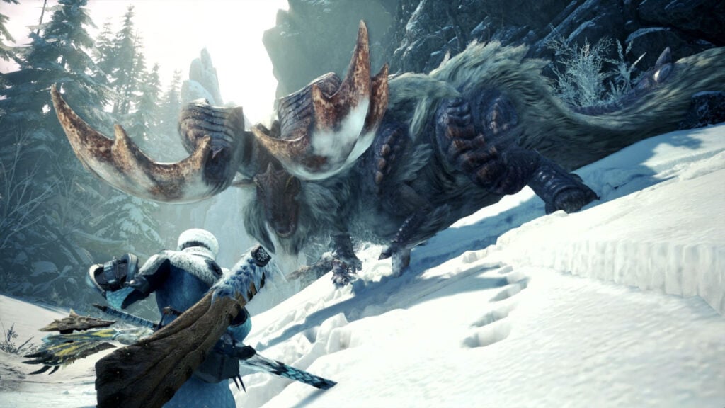 A hunter braces for a clash with a monster in the snow in Monster Hunter World Iceborne