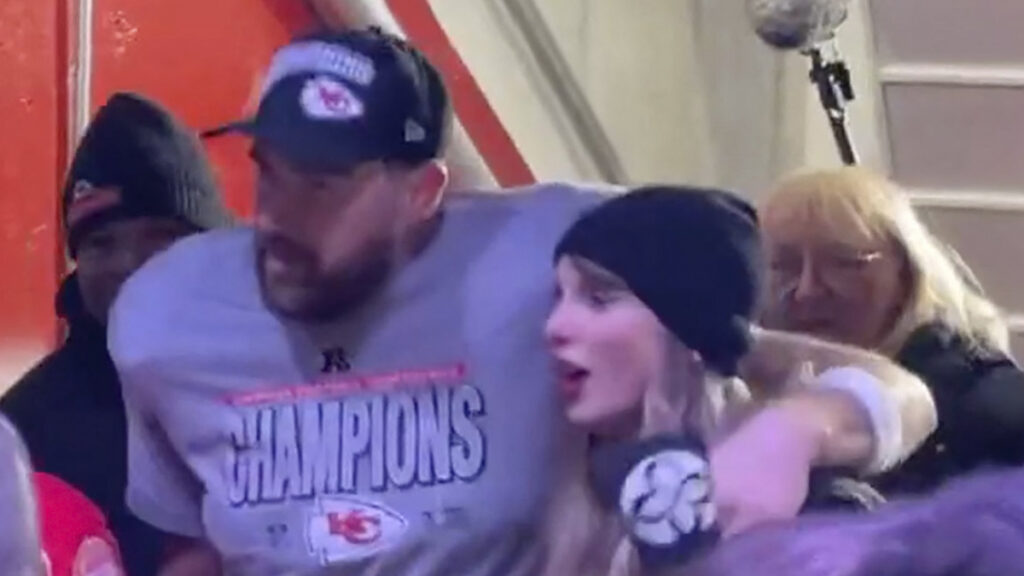 Travis Kelce and Taylor Swift leave Arrowhead Stadium field to cheers after KS Chiefs' big win.