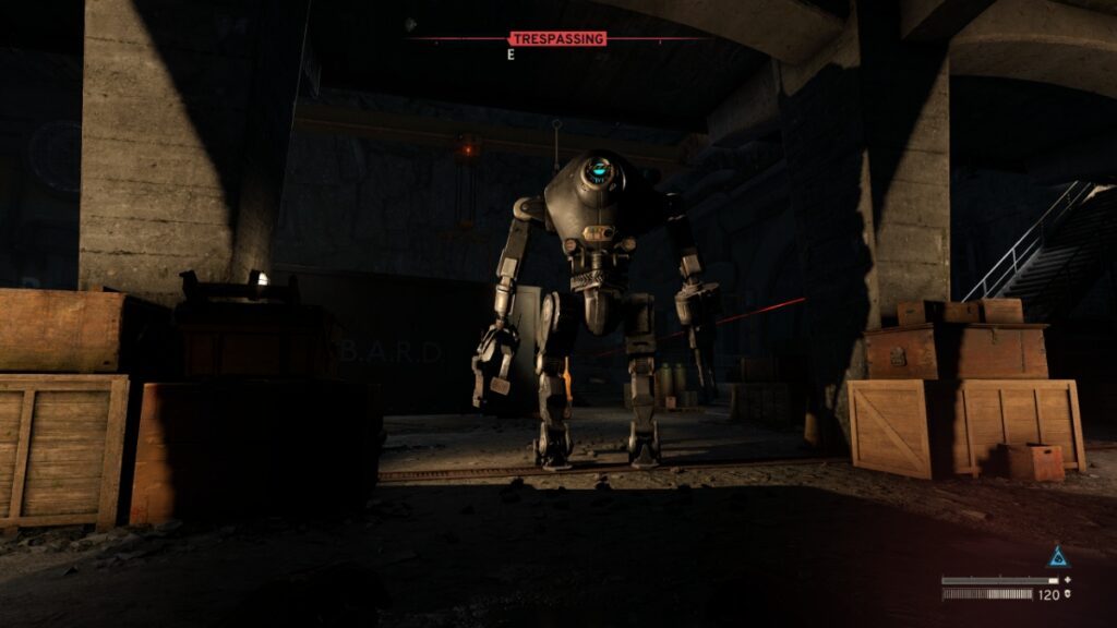 A player uses the shadows to sneak
behind a B.A.R.D. robot in an underground bunker