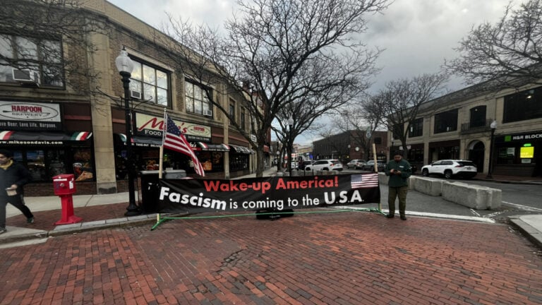 Davis Square Banner Tells Boston ‘Fascism Is Coming To the U.S.A.’ After Tufts Student Abduction: ‘Coming? It’s Here’ A large banner at Davis Square in Boston reads: "Wake-up America! Fascism is coming to the U.S.A."