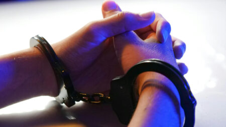 San Diego Among the Californian Cities to Strip Offending Officers of Badges: ‘Those Things Sure Sound Like Crimes’ Hands bound with black handcuffs