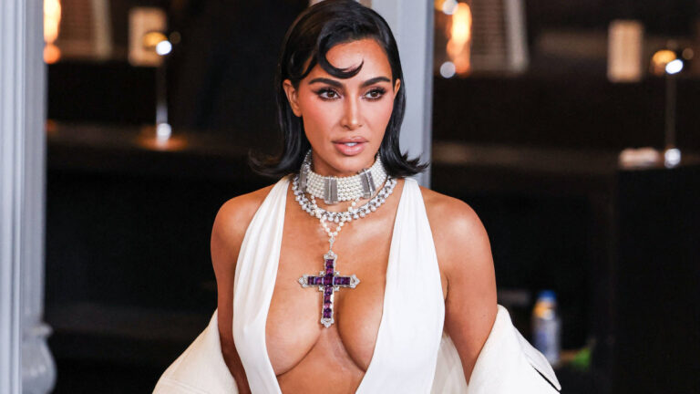 Kim Kardashian wearing a custom Gucci dress and coat with a Tallarico pearl choker, Bvlgari pearl and diamond necklace, and Princess Diana’s amethyst cross arrives at the 13th Annual LACMA Art + Film Gala 2024.