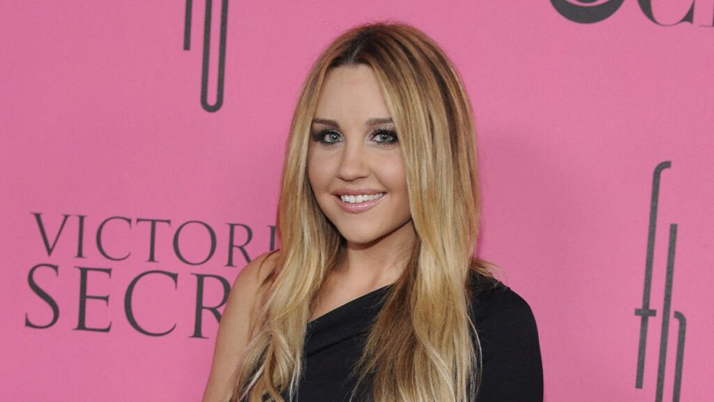 Amanda Bynes arrives on the pink carpet for Victoria's Secret Fashion Show at the Fontainebleau in Miami Beach