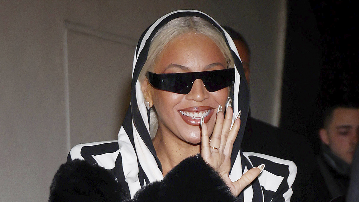 Beyonce is all smiles as she waves to fans while leaving 'Mea Culpa' screening at the Paris Theater