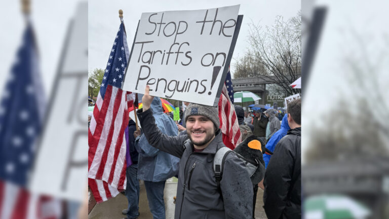 Among the Hands-Off Protests, One Cincinnati Individual is Fighting for Penguins Cincinnati Hands-Off Protest Penguin Sign