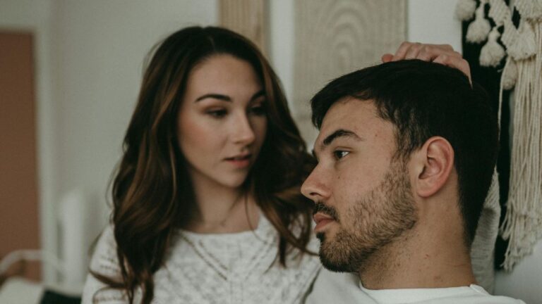 Woman staring accusingly at man