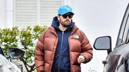 Scott Disick wearing sunglasses while doing errands