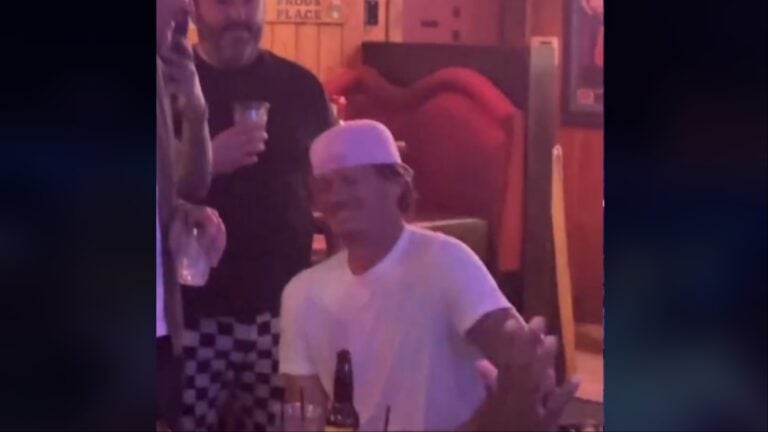 Tom DeLonge watches a fan preform his song in a California bar