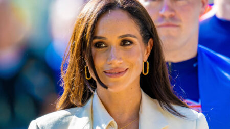 Meghan Markle ins white outfit.