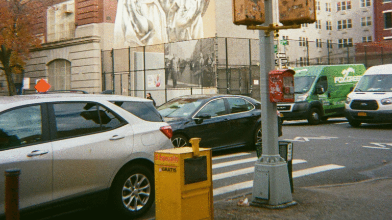 NYC Street with Cars Driving About