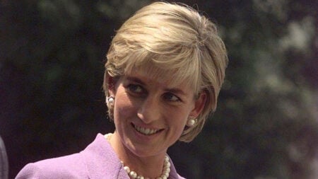 The late Princess of Wales, Princess Diana in purple suit.