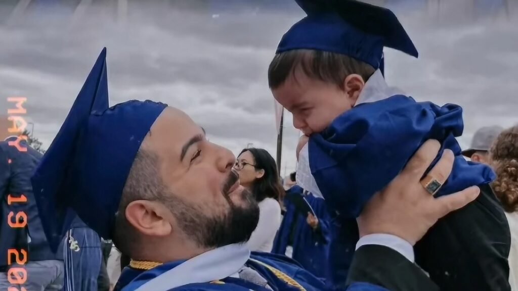 New York Graduate Chased Off Ceremony by Cops for Carrying Illegal Baby: ‘The Infant Hasn’t Earned Credits to Receive a Diploma’ Graduate dad and baby in New York