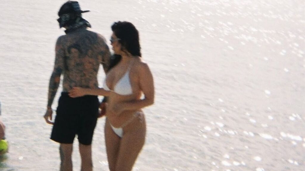 Kourtney Kardashian in a white bikini alongside Travis Barker