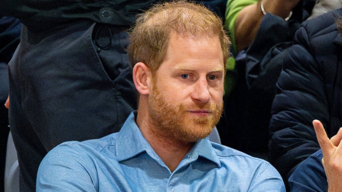Prince Harry wearing a blue shirt at event