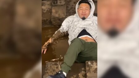 Man lying on the tracks of the New York subway