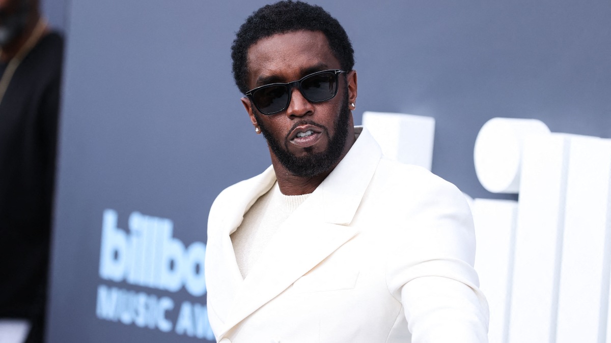 Photo of Sean "Diddy" Combs in a white suit.