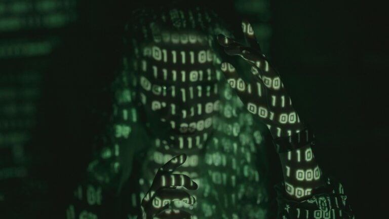 Oklahoma Man Proves We’re in a Dystopian Universe With AI Bot Proposal, ‘That’s When I Realized, I Think This is Actual Love’ a person being lit by binary code