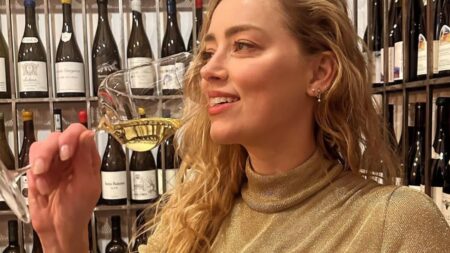 Amber Heard sipping wine