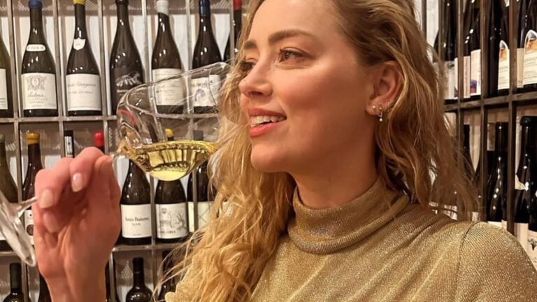‘Toxic’ Amber Heard Returns To Acting, But Fans Aren’t Having It: ‘Dreadful Actress’ Amber Heard sipping wine