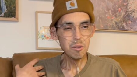 Tanner sitting in bed