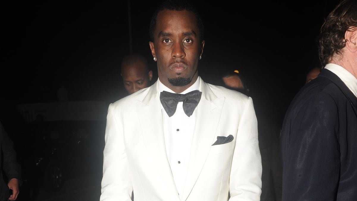 Sean "Diddy" Combs wearing a white suit.