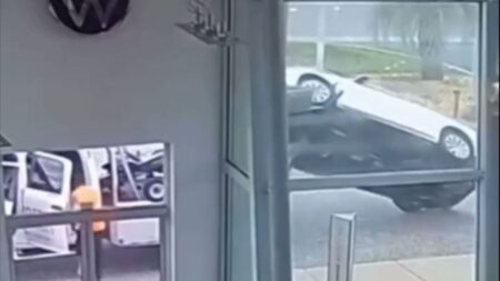 A tow truck accidentally flipping an audi SUV