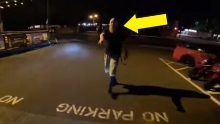 Security Guard Tackles squealing Motorcyclist