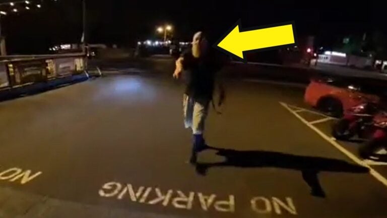 Security Guard Tackles squealing Motorcyclist