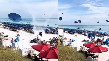 Umbrellas flying around on florida beach