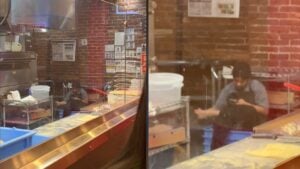 dominos employee rubbing feet on the job